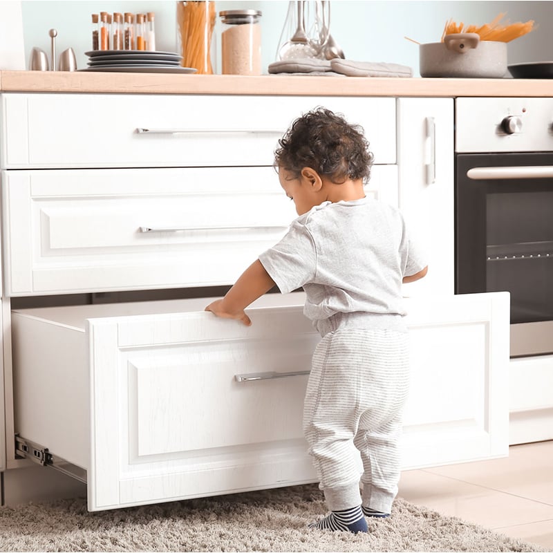 child opening drawer