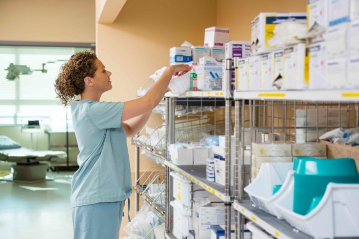 nurse grabbing medical supplies from packaging